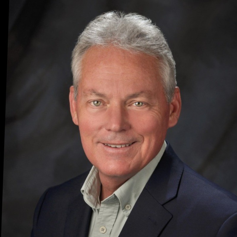 Portrait of Mark Gibson, co-founder of Quantum Dynamics and principal owner of Timberland Helicopters