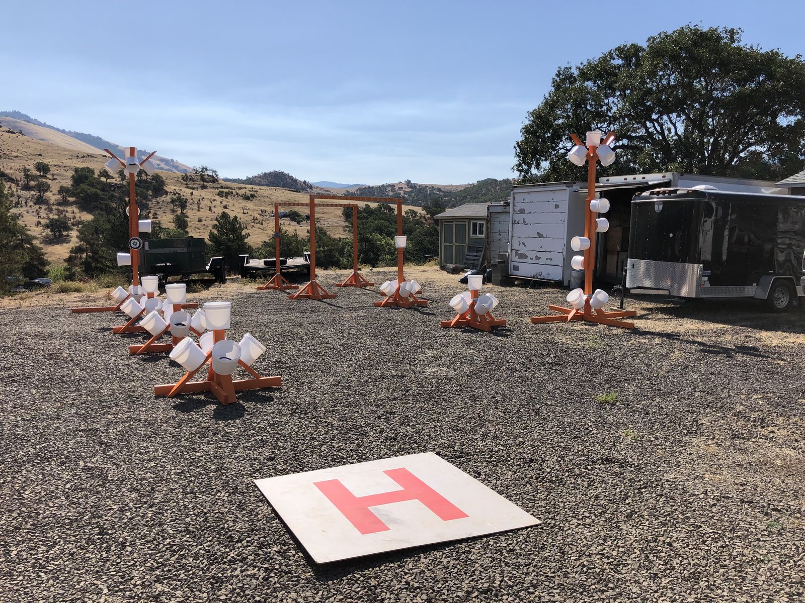 The NIST practical flight course laid out on the Quantum Dynamics training ground: bucket stands, gates, and the red H landing pad